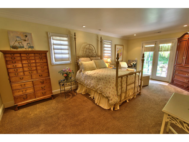3055 Sloat Road Pebble Beach, CA 93953 - Photo 10 of 25 a bed room with a bed and a window