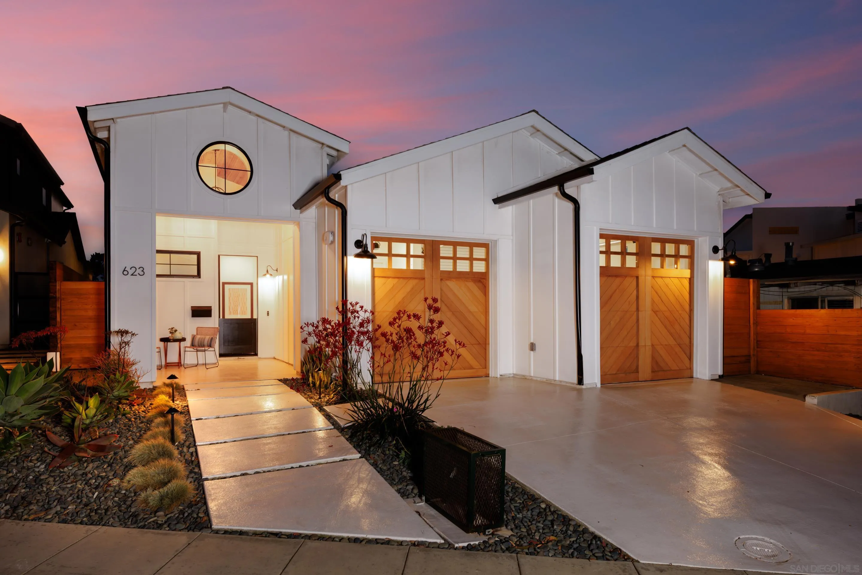 a view of living room with furniture and wooden floor