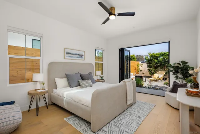 a bedroom with a balcony a bed and a couch