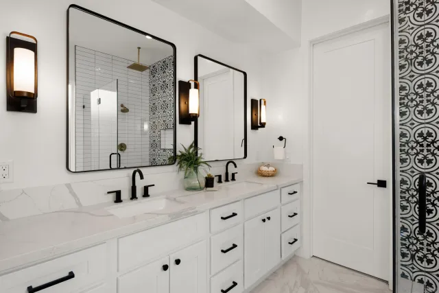 a bathroom with a double vanity sink and mirror