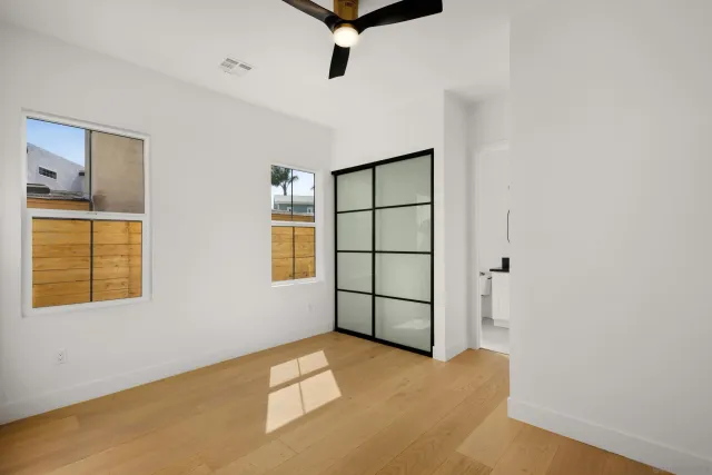 a view of a room with cabinet and windows