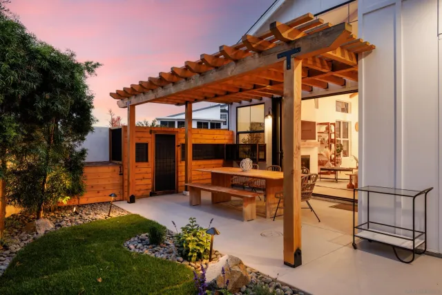 a view of a patio with a table and chairs