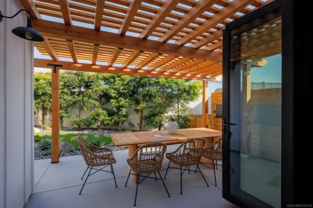 a table and chairs in front of a building