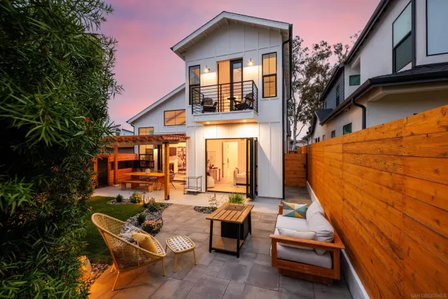 a front view of house with outdoor seating