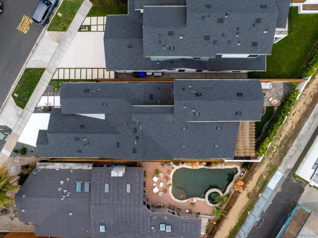 an aerial view of house with a yard