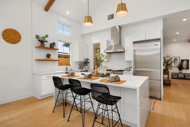a kitchen with a table and chairs in it