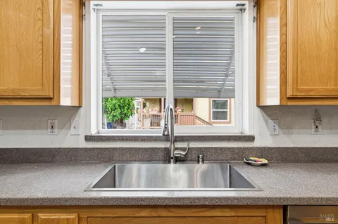 a kitchen sink with a window