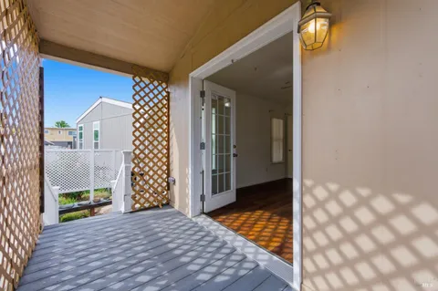 a view of a balcony with wooden floor