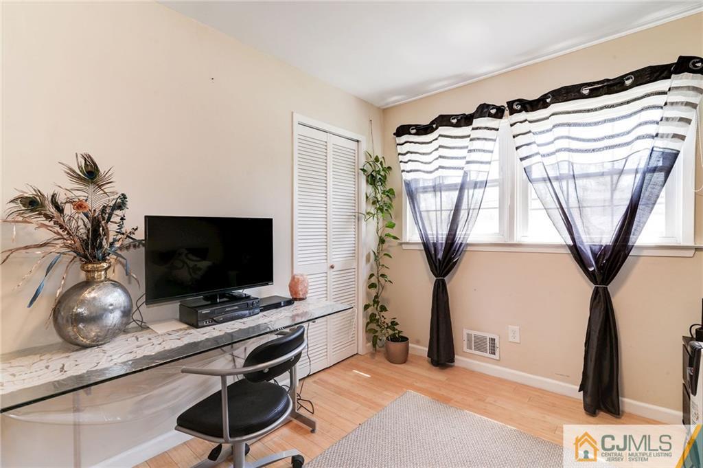17 Wilk Road Edison, NJ 08837 - Photo 11 of 22 a view of a livingroom with furniture and a potted plant