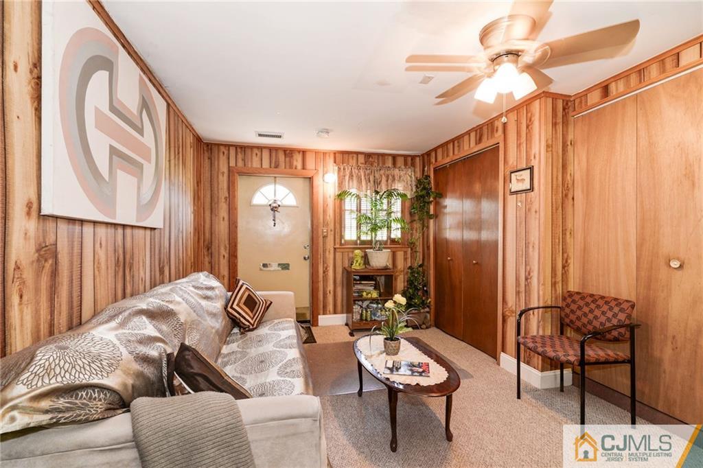 17 Wilk Road Edison, NJ 08837 - Photo 14 of 22 a living room with furniture and a large window
