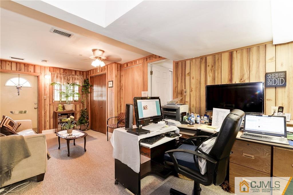17 Wilk Road Edison, NJ 08837 - Photo 15 of 22 a view of a livingroom with workspace and a couch