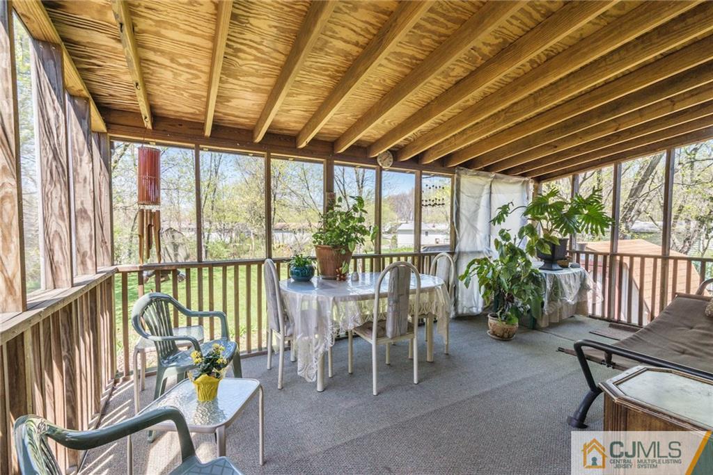 17 Wilk Road Edison, NJ 08837 - Photo 19 of 22 a dining room with furniture water view and pool table and chairs