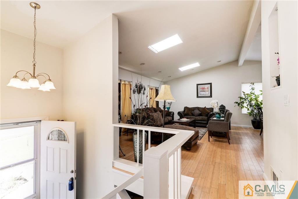 17 Wilk Road Edison, NJ 08837 - Photo 4 of 22 a view of a living room and kitchen