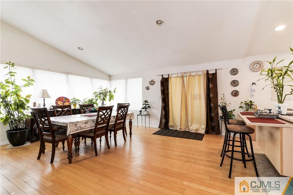 17 Wilk Road Edison, NJ 08837 - Photo 6 of 22 a view of a dining room with furniture and wooden floor