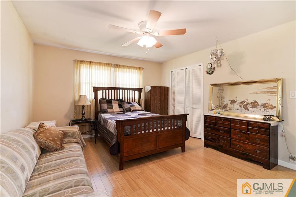 17 Wilk Road Edison, NJ 08837 - Photo 10 of 22 a bedroom with a bed and window