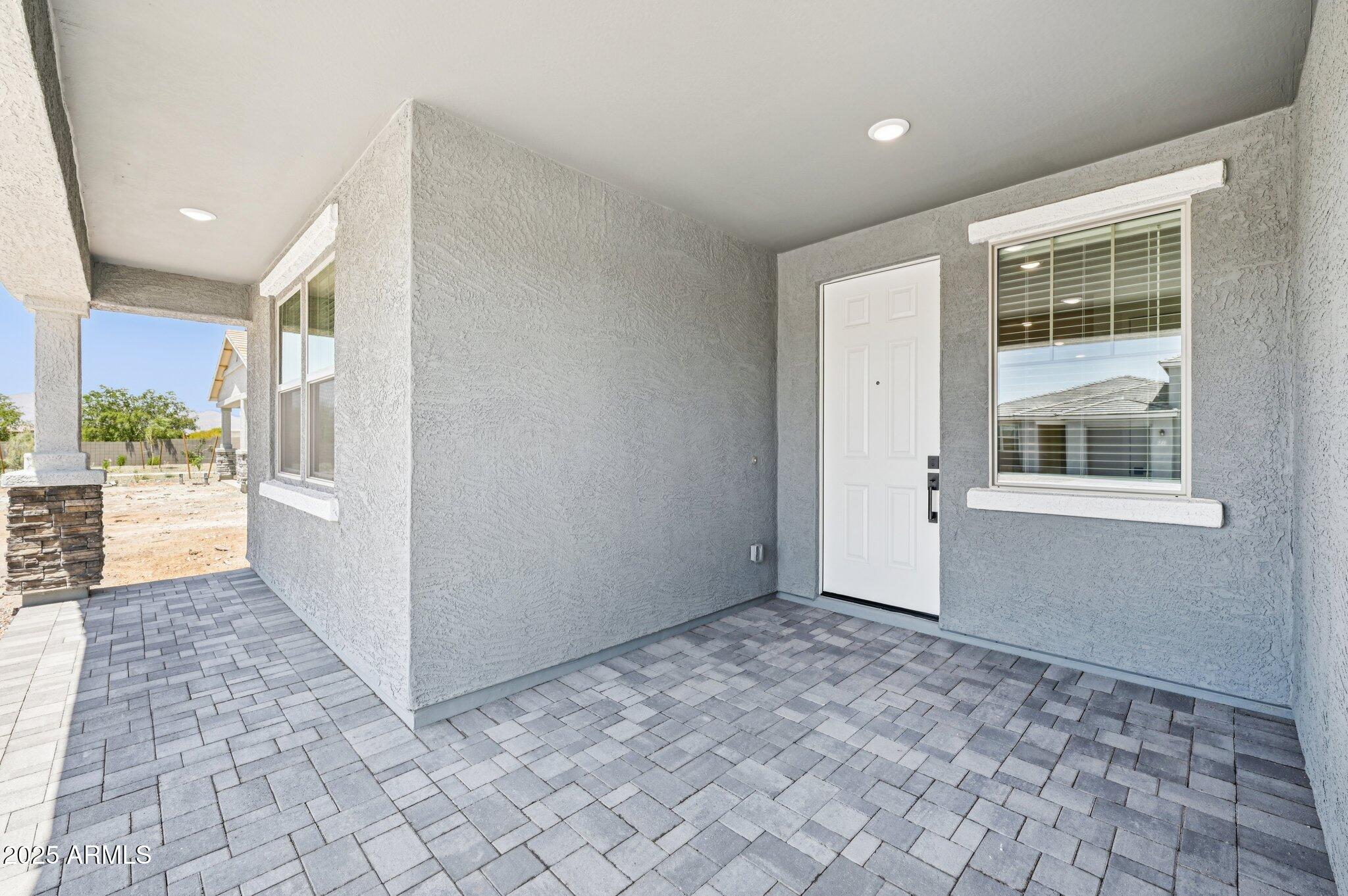 15794 West Cheryl Drive Waddell, AZ 85355 - Photo 3 of 53 a view of an empty room and window