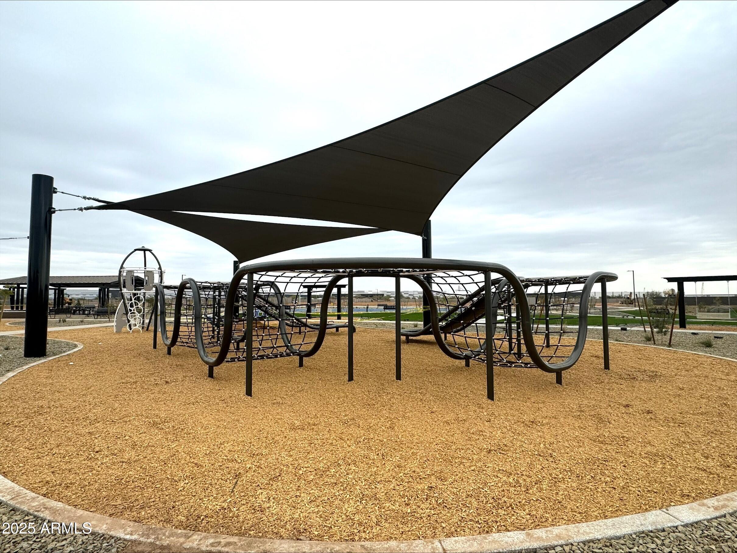 15794 West Cheryl Drive Waddell, AZ 85355 - Photo 51 of 53 a view of a swimming pool with an outdoor seating