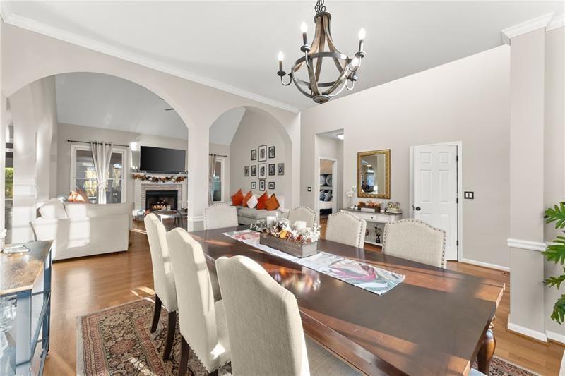 385 Graves Road Acworth, GA 30101 - Photo 13 of 61 a view of a dining room with furniture a chandelier and wooden floor