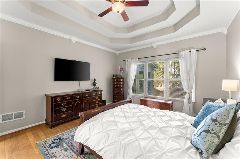 385 Graves Road Acworth, GA 30101 - Photo 19 of 61 a bedroom with a bed and a flat screen tv