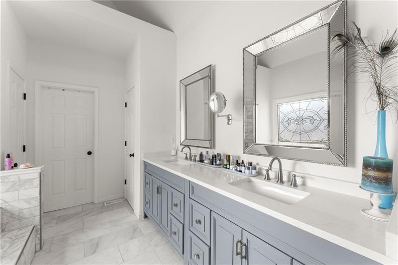 385 Graves Road Acworth, GA 30101 - Photo 21 of 61 a bathroom with a double vanity sink mirror and double