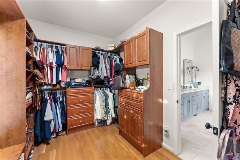 385 Graves Road Acworth, GA 30101 - Photo 22 of 61 a view of walk in closet with clothes and shoes
