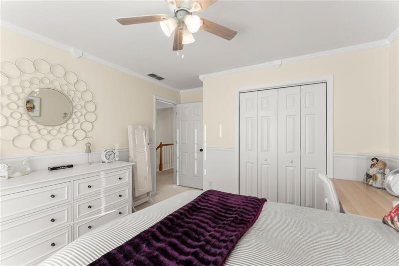 385 Graves Road Acworth, GA 30101 - Photo 25 of 61 a bedroom with a bed and a dresser in it