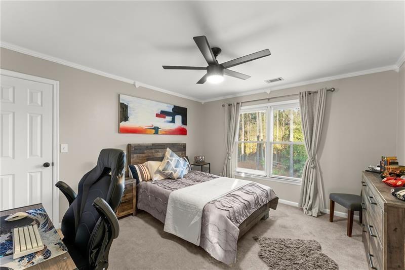 385 Graves Road Acworth, GA 30101 - Photo 28 of 61 a bedroom with a bed furniture and a window