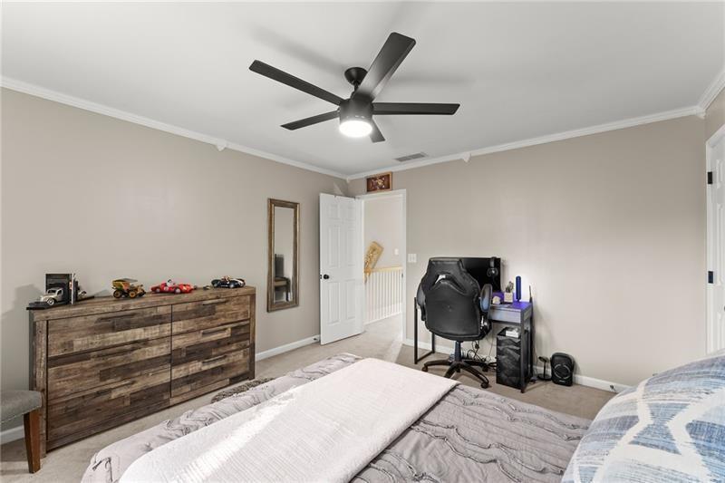 385 Graves Road Acworth, GA 30101 - Photo 29 of 61 a bedroom with a bed and a chair