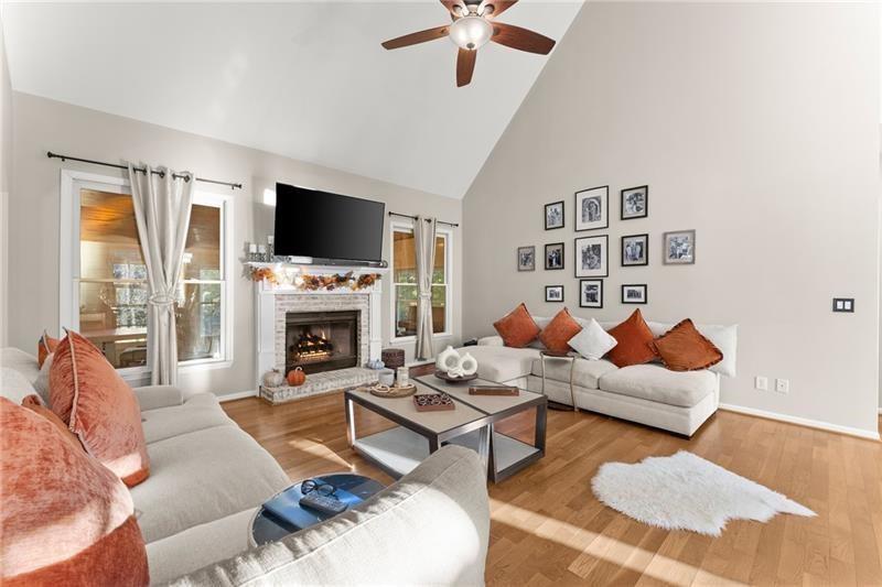 385 Graves Road Acworth, GA 30101 - Photo 3 of 61 a living room with furniture a flat screen tv and a fireplace