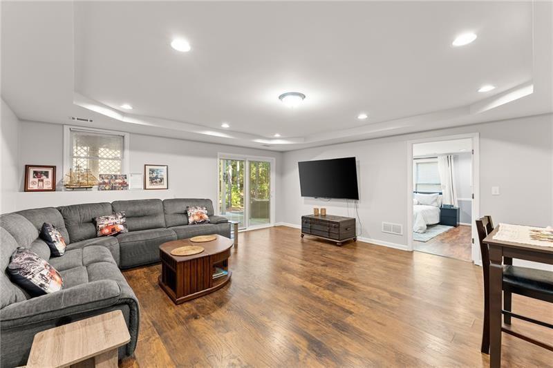 385 Graves Road Acworth, GA 30101 - Photo 33 of 61 a living room with furniture flat screen tv and large window