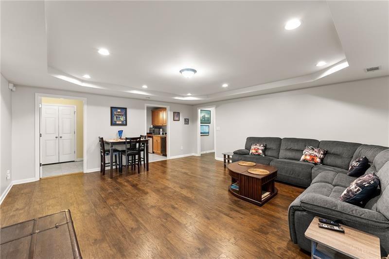 385 Graves Road Acworth, GA 30101 - Photo 34 of 61 a living room with furniture and a dining table with kitchen view