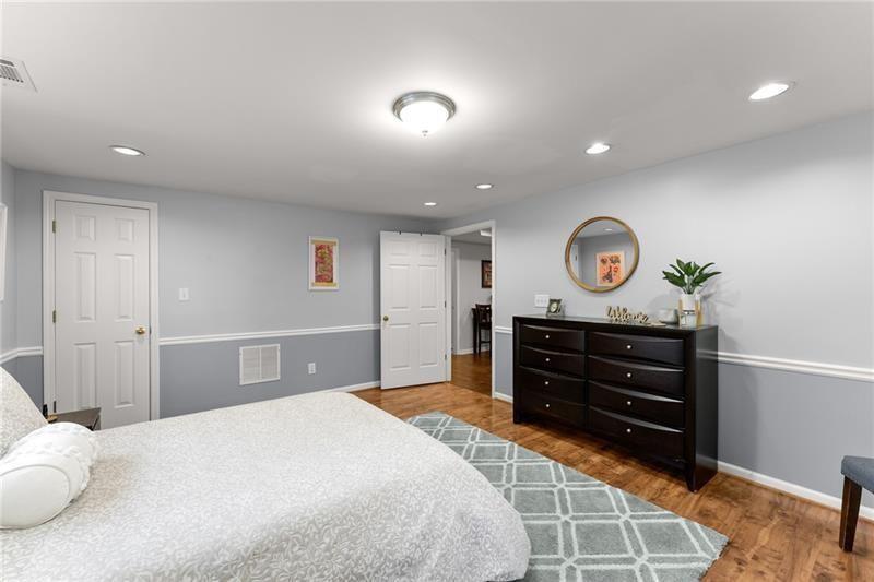 385 Graves Road Acworth, GA 30101 - Photo 36 of 61 a bedroom with a bed and cabinets