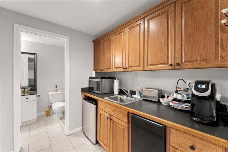 385 Graves Road Acworth, GA 30101 - Photo 38 of 61 a kitchen with stainless steel appliances granite countertop a sink and cabinets