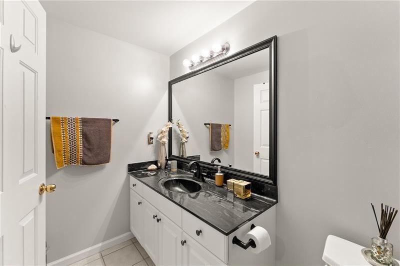 385 Graves Road Acworth, GA 30101 - Photo 39 of 61 a bathroom with a sink and a mirror with toilet
