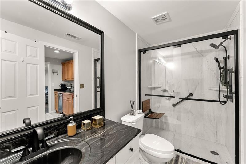 385 Graves Road Acworth, GA 30101 - Photo 40 of 61 a bathroom with a sink and a mirror