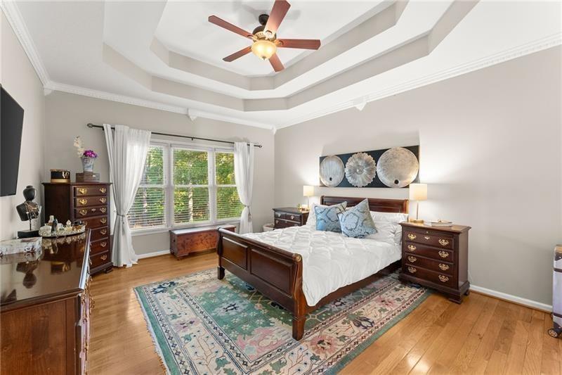 385 Graves Road Acworth, GA 30101 - Photo 6 of 61 a bedroom with a large bed and a chandelier