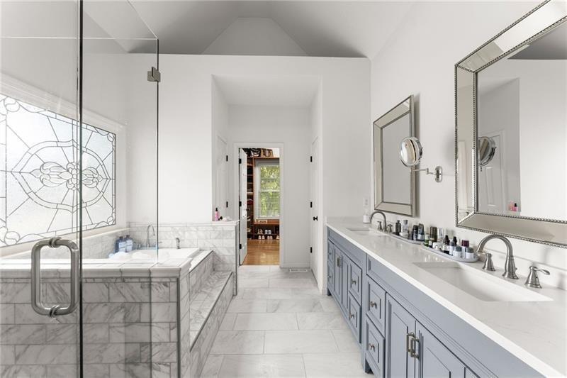 385 Graves Road Acworth, GA 30101 - Photo 7 of 61 a bathroom with a double vanity sink a mirror and a bathtub