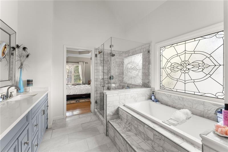 385 Graves Road Acworth, GA 30101 - Photo 8 of 61 a spacious bathroom with a tub sink and mirror