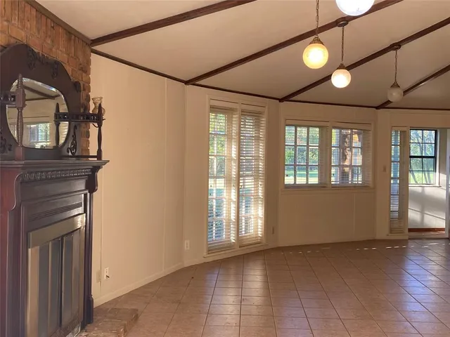 a view of empty room with windows