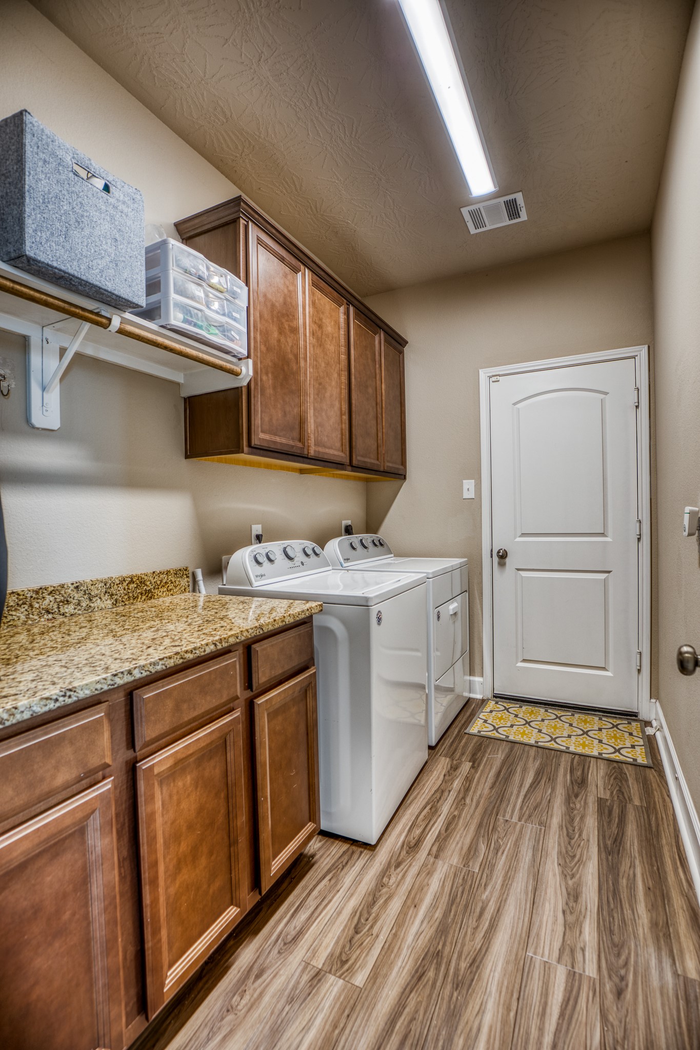 2004 Vineyard Pass Brenham, TX 77833 - Photo 13 of 37 a kitchen with granite countertop a stove and cabinets