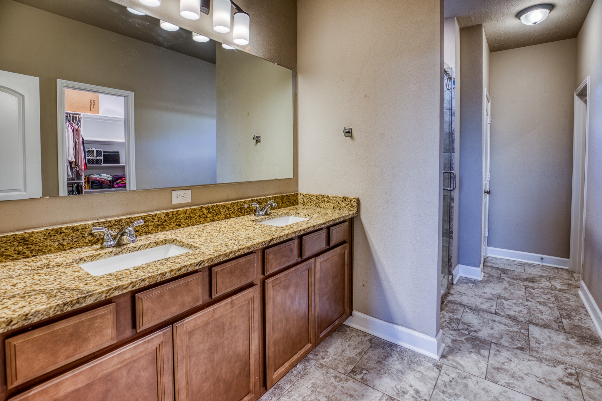 2004 Vineyard Pass Brenham, TX 77833 - Photo 19 of 37 a bathroom with a granite countertop sink and a mirror