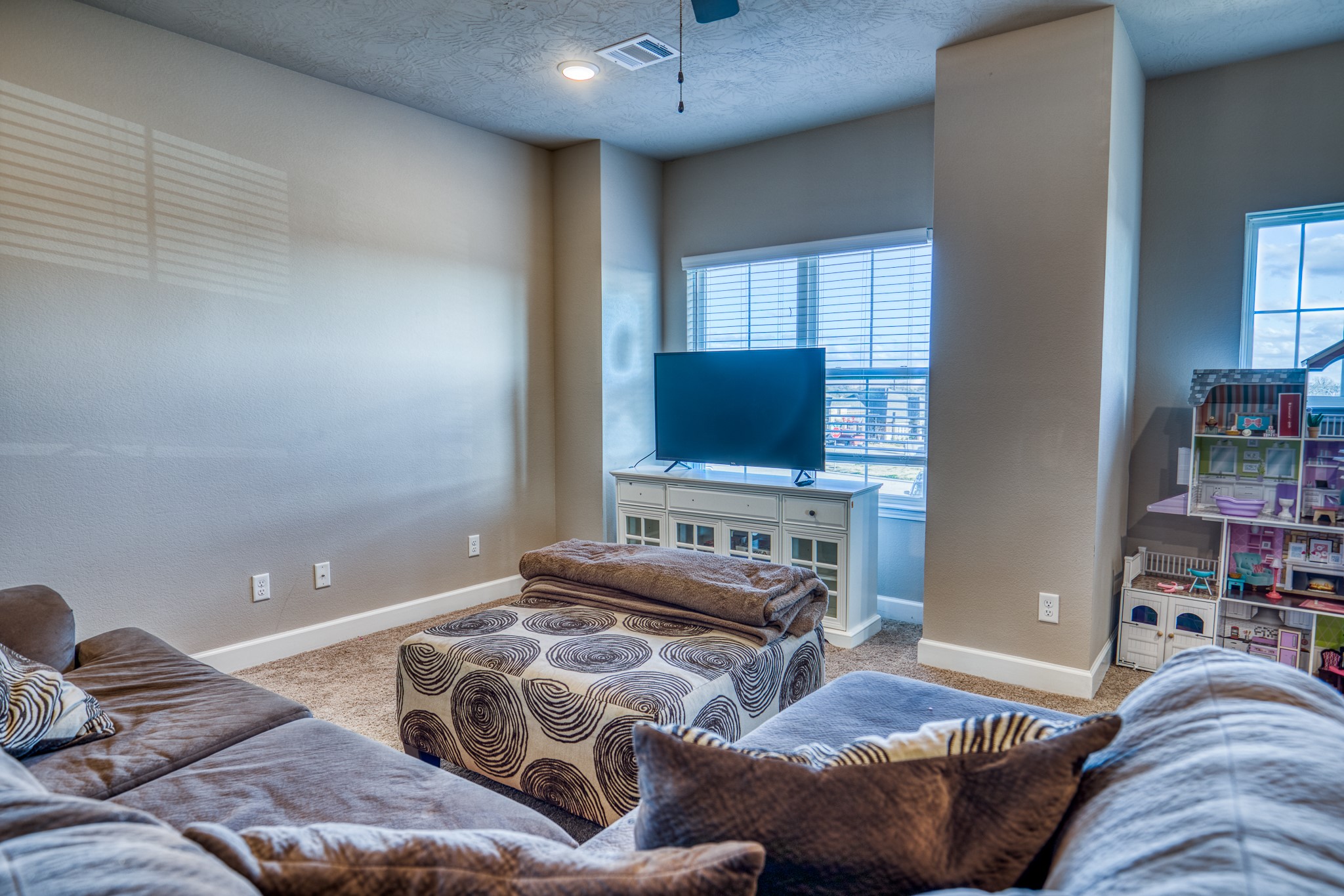 2004 Vineyard Pass Brenham, TX 77833 - Photo 23 of 37 a bedroom with furniture and a flat screen tv