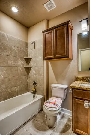 a bathroom with a toilet sink and bathtub