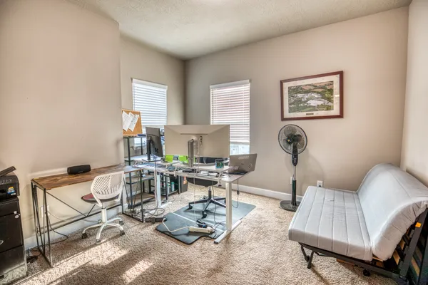 a living room with furniture a window and a table