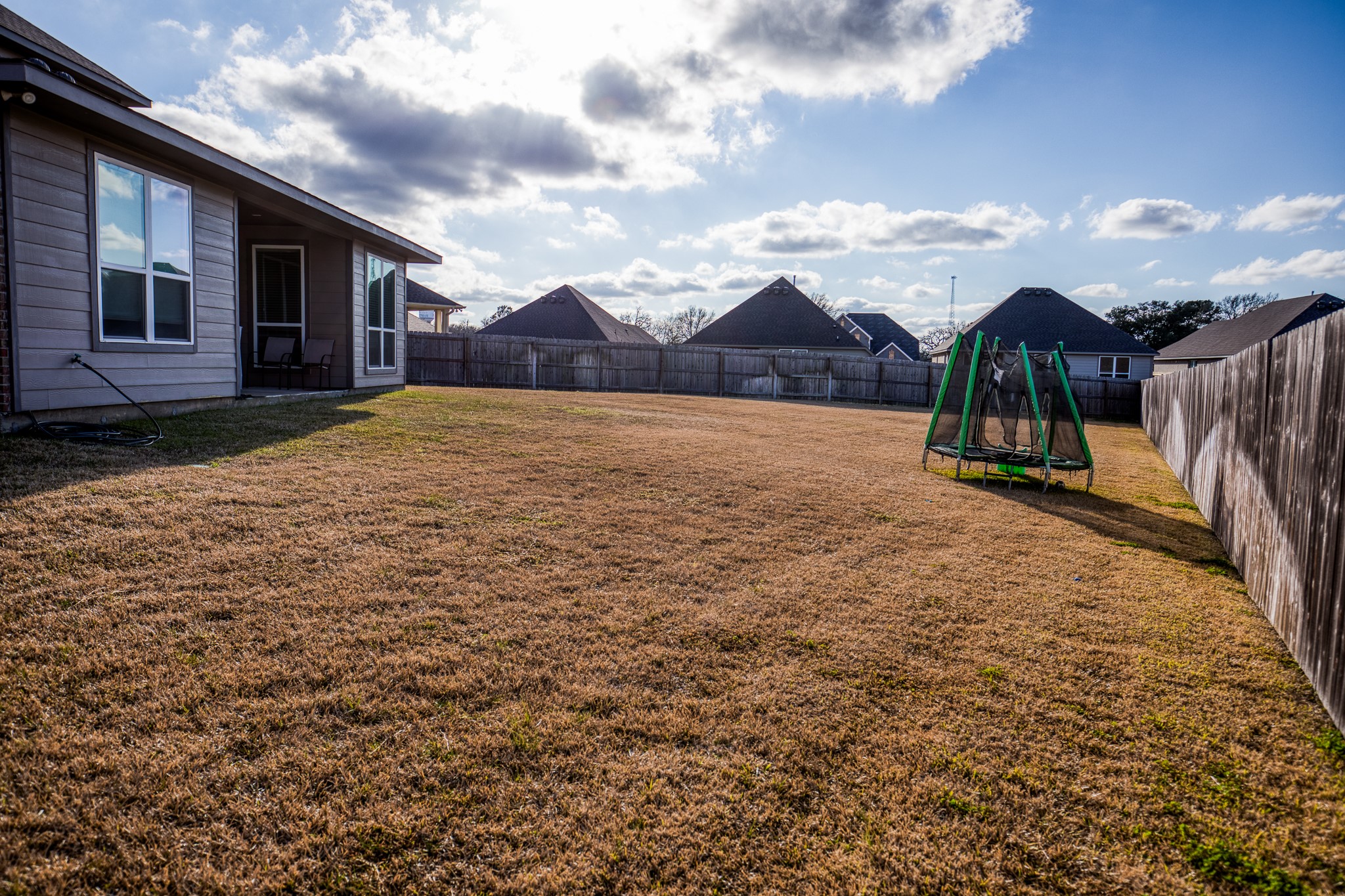 2004 Vineyard Pass Brenham, TX 77833 - Photo 33 of 37 a view of a house with a yard