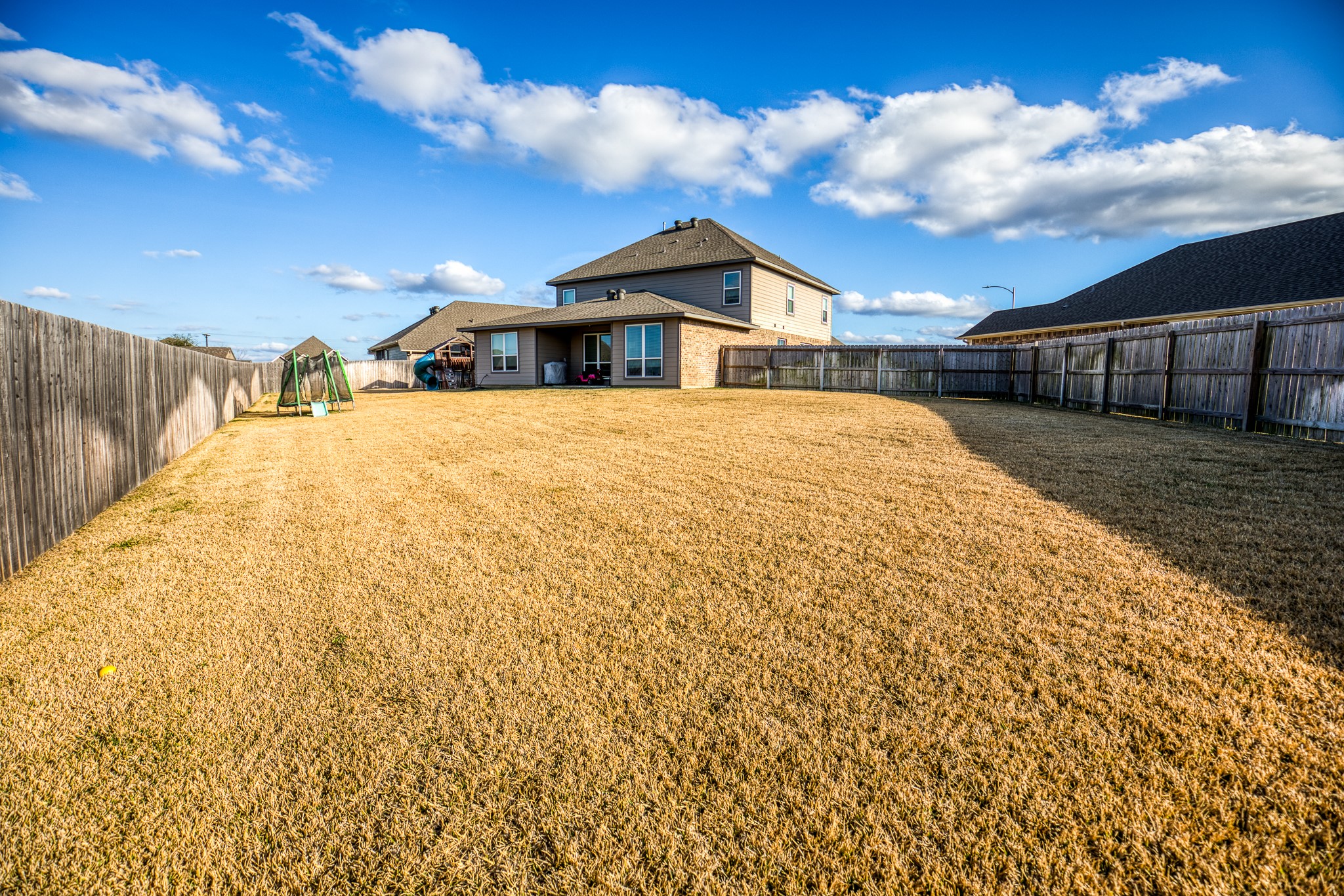 2004 Vineyard Pass Brenham, TX 77833 - Photo 37 of 37 a front view of a house with a yard