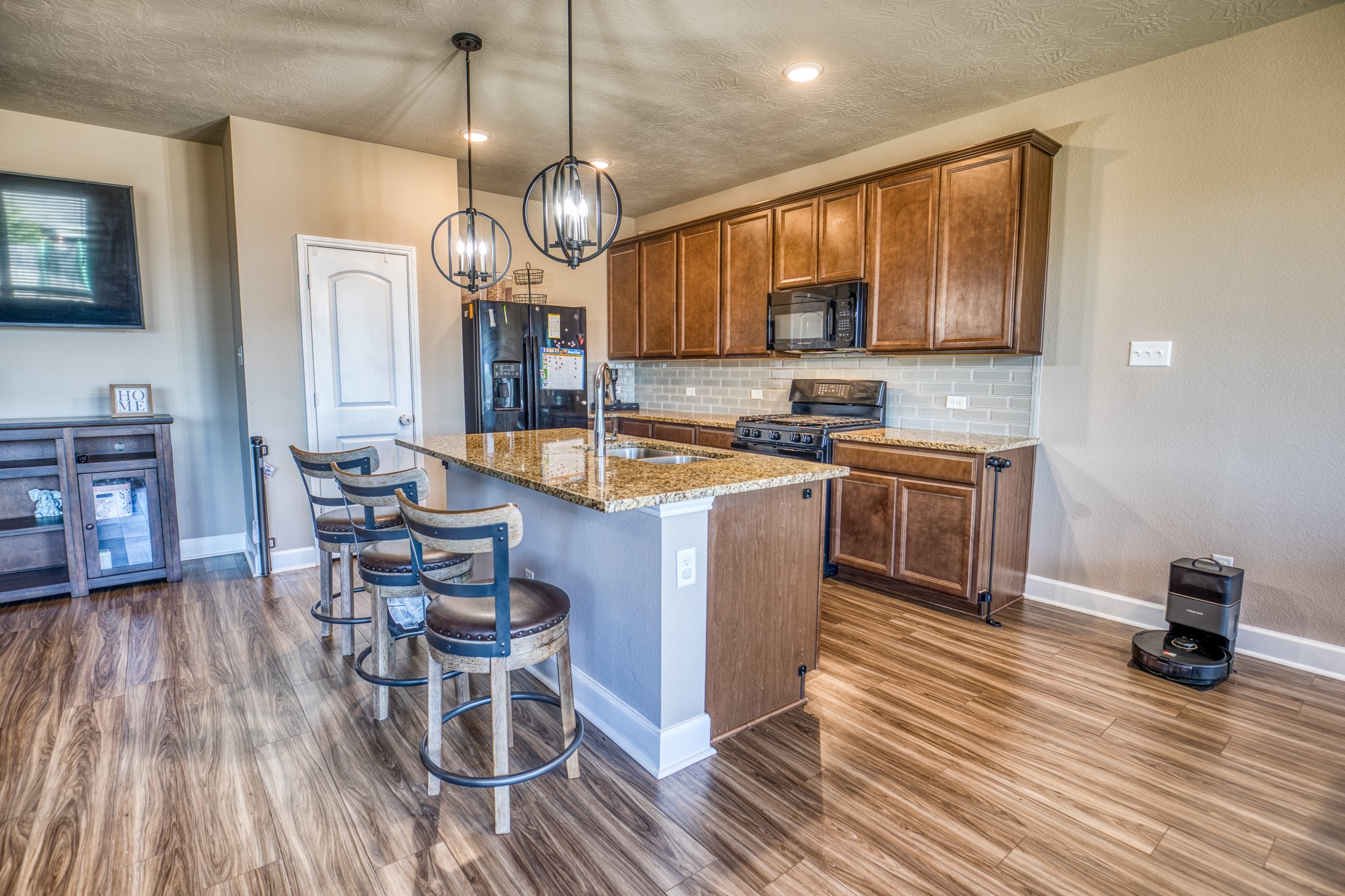 2004 Vineyard Pass Brenham, TX 77833 - Photo 7 of 37 a large kitchen with a table and chairs in it