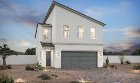 View of front of property with an attached garage, stucco siding, and decorative driveway