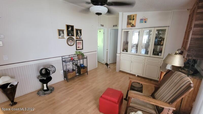 926 Yew Street Sebastian, FL 32976 - Photo 11 of 36 a view of a livingroom with furniture and a ceiling fan