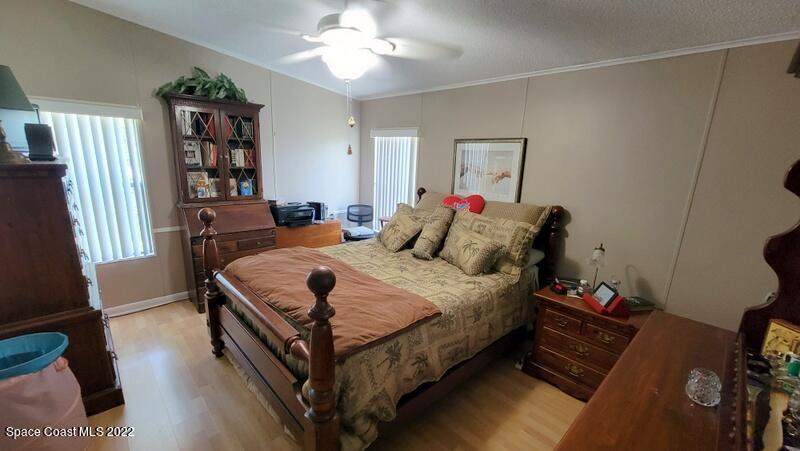 926 Yew Street Sebastian, FL 32976 - Photo 14 of 36 a bedroom with bed and a window